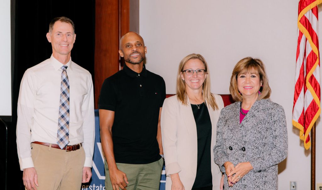 The three WICHE officers and president standing side by side